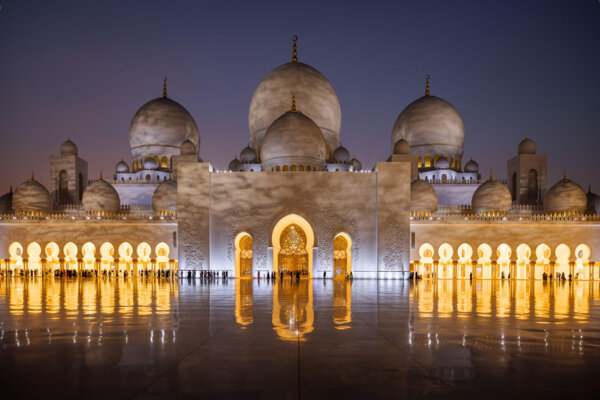 Architectural details of the majestic Sheikh Zayed Bin Sultan Al Nahyan Mosque in Abu Dhabi at night.