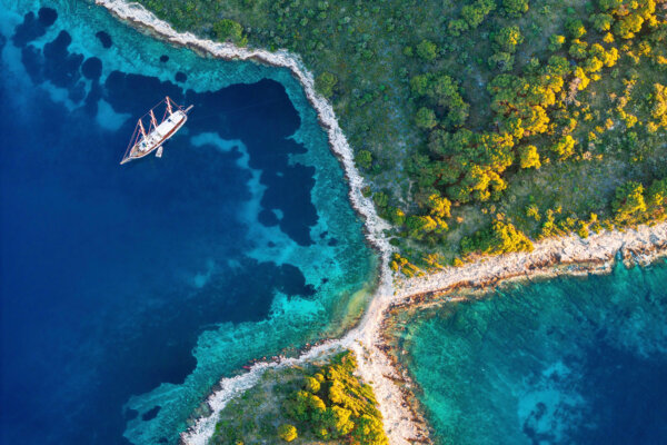 Bay with sailing boat, Pakleni or Paklinski Islands off the island of Hvar, Dalmatia, Croatia